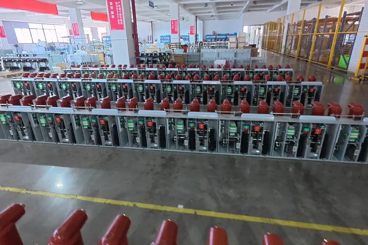 Rows of medium-voltage distribution equipment on a production floor