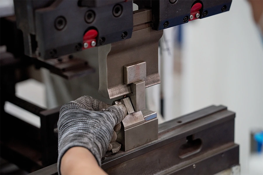 Metal strip forming with press tooling