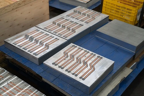 Aluminium cold plates with embedded copper tubes