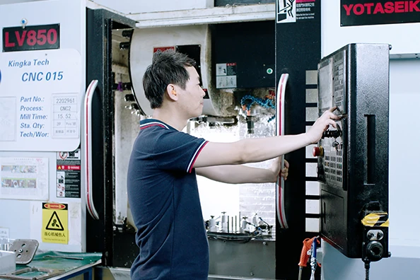 Operator setting up a machining workstation