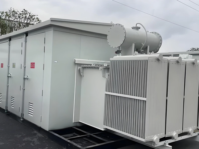 Assembled transformer beside a substation enclosure