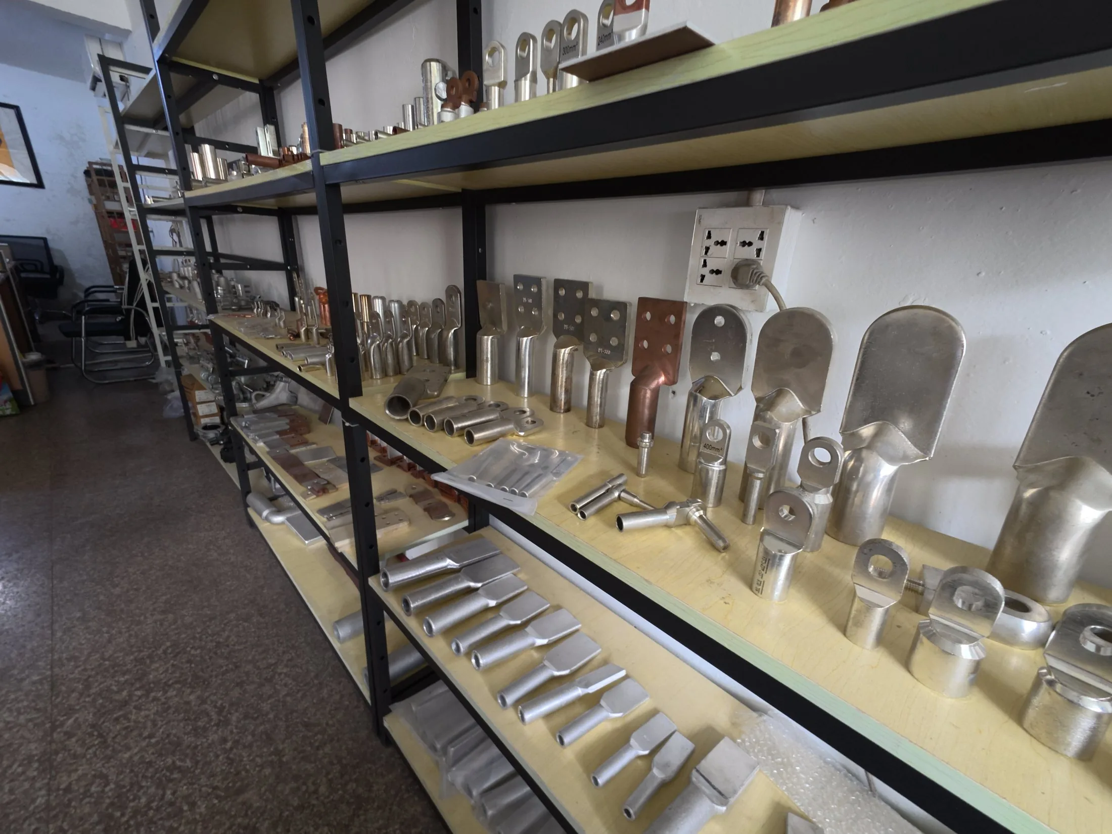 Metal terminal and connection component samples arranged for review